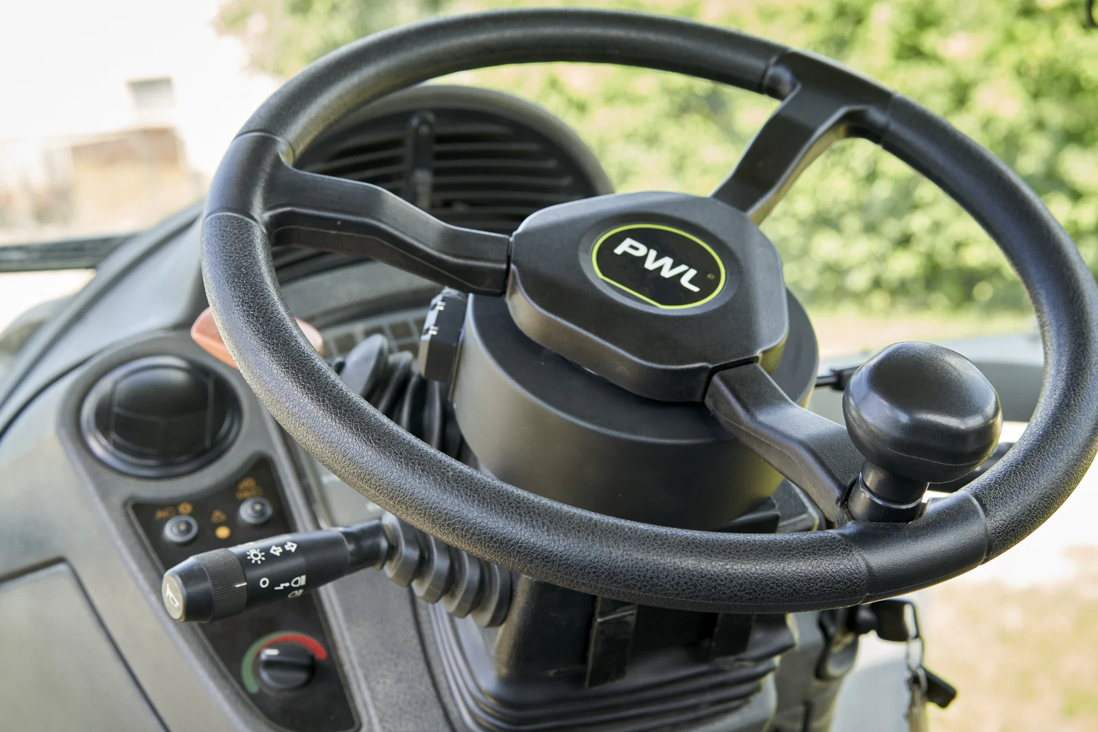 PWL motorised steering wheel with original green branding